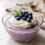 Delicious blueberry cottage cheese mousse in a dessert bowl, garnished with fresh blueberries.