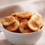 Homemade air fryer banana chips topped with cinnamon sugar