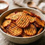 Bowl of crispy healthy carrot chips for a smart snack choice