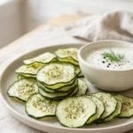 Homemade crunchy ranch cucumber chips on a plate
