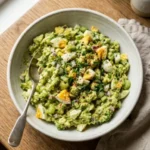 High protein avocado egg salad with ingredients in a bowl