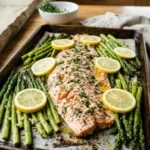 Lemon Garlic Herb Salmon served with fresh asparagus on a plate