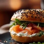 Smoked salmon and cream cheese bagel topped with fresh herbs
