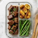 Garlic Balsamic Steak Bites served in a bowl with herbs