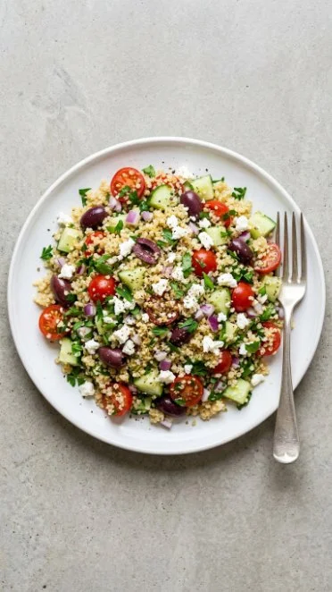 Greek quinoa salad with fresh vegetables and feta cheese