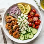 Greek shrimp Mediterranean bowl with fresh vegetables and grains