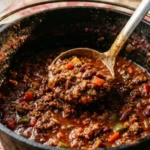 Bowl of flavorful no bean keto chili topped with cheese and herbs
