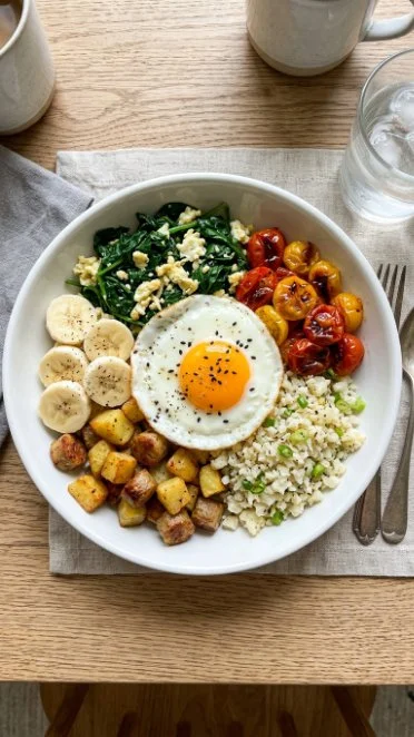 Delicious protein-packed breakfast bowl with eggs, veggies, and grains.
