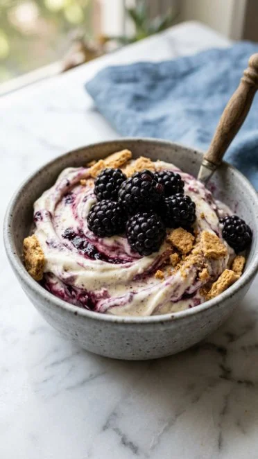Blackberry Cheesecake Cottage Cheese Ice Cream in a bowl with fresh berries