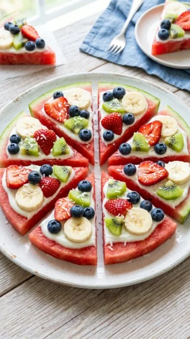 Delicious Watermelon Pizza topped with fruits and mint