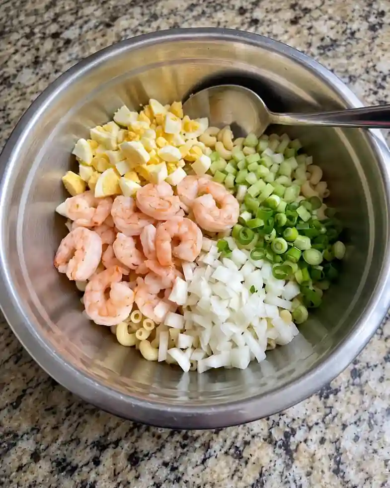 Creamy Shrimp Macaroni Salad- in bowl mix