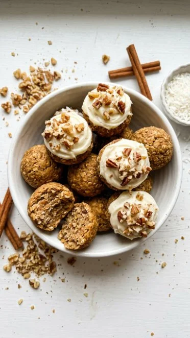 Delicious carrot cake truffles coated in rich chocolate, paired with a sprinkle of coconut.
