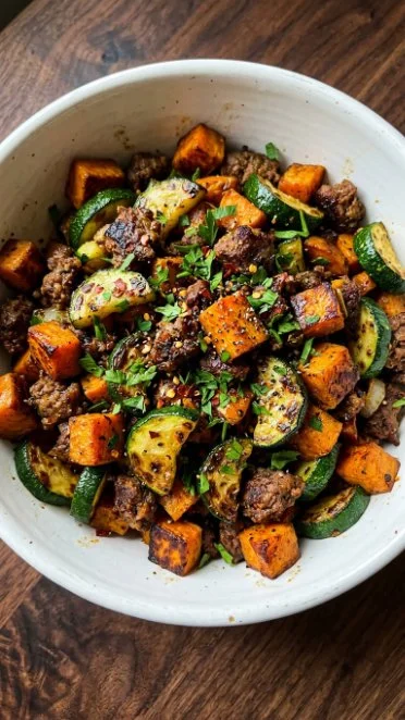 Hearty beef zucchini and sweet potato skillet dish served in a pan